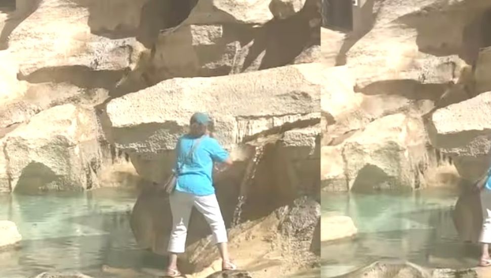 Una turista trepó a la Fontana di Trevi para tomar agua